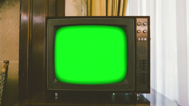 Loopable vintage television set turns on and off with replaceable chroma key green screen