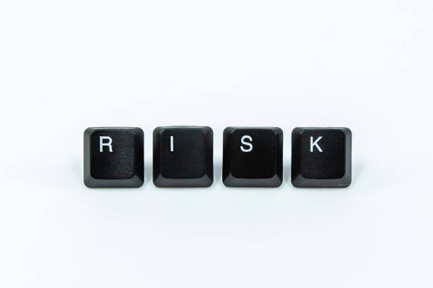 istock Keyboard keys saying risk isolated on white. 1327382064
