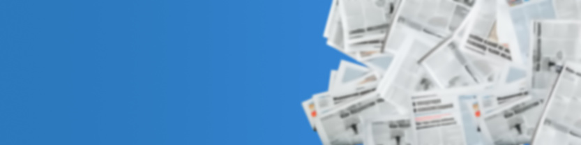 Abstract, blurred image of newspapers on a blue background. Media news concept. Panoramic image.