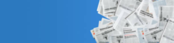 abstract, blurred image of newspapers on a blue background. media news concept. panoramic image. - newspaper blank business the media imagens e fotografias de stock