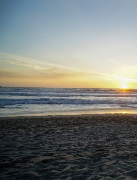 istock Watching the sunset at Baker Beach in San Francisco 1327397544
