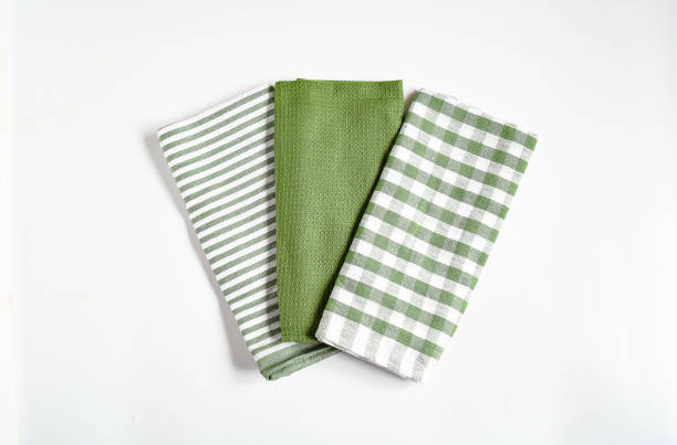 istock Top view new kitchen towels in verdun green ,strip and white color simple pattern in differnet style on white background .Equipment necessary  in kithchen for wippe things. 1327402972