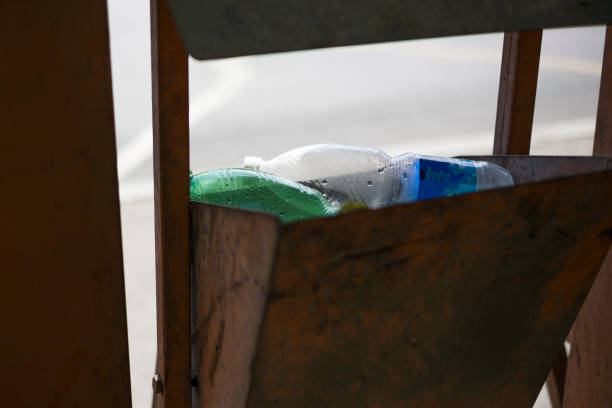 istock plastic bottle into the tank. close up 1327409035