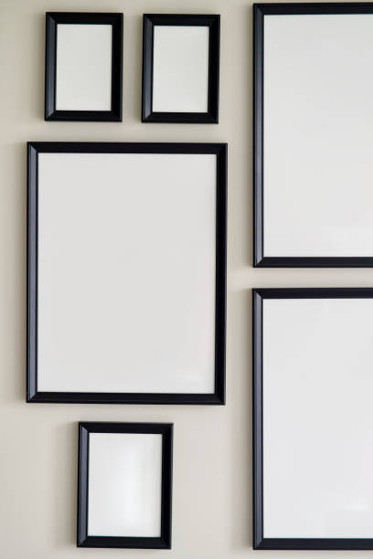 istock Different size framed photos hanging on the gray wall. Mockup 1327410291