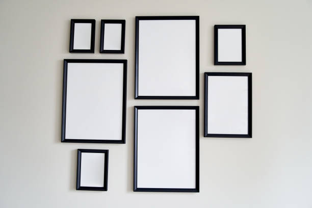 istock Different size framed photos hanging on the gray wall. Mockup 1327411066