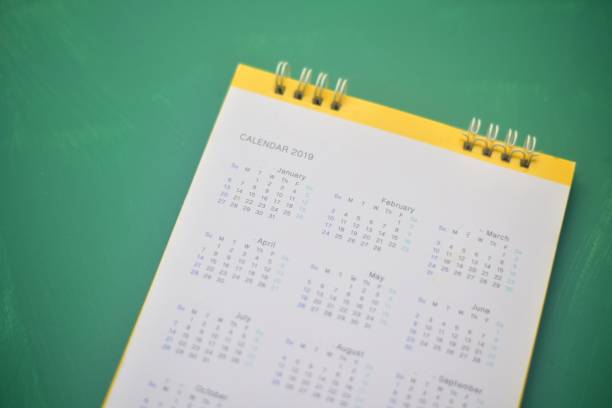 istock Close up calendar on green background Planning concept. 1327416431