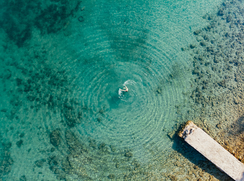 Aerial View Young Woman Swimming in the Sea