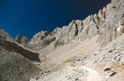 Deserted landscape in the Picos de Europa, Spain. The photo was taken at the Torre de los Horcados Rojos. The Torre de los Horcados Rojos is one of the most distinctive peaks of the Macizo Central in the Picos de Europa, on the border between Cantabria and Asturias. From this peak, one has a fantastic view of the amazing landscape of the Picos.