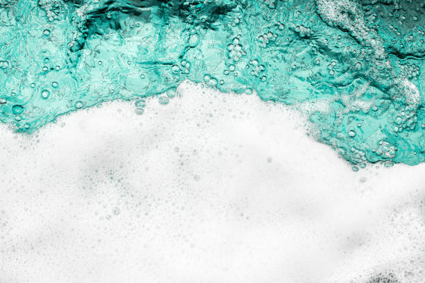 istock Blue sea water white foam texture background closeup, foamy ocean wave pattern, aqua bubbles surface, swimming pool backdrop, abstract summer sunny beach wallpaper, decorative frame border, copy space 1327418633