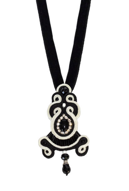 istock Beautiful black - white accessory, necklace on white background 1327419082