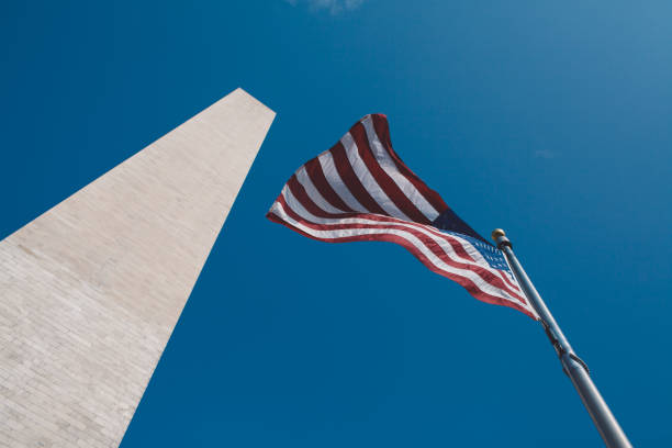 istock Low Angle View Of Flag Against Clear Blue Sky 1327420479