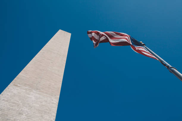 istock Low Angle View Of Flag Against Clear Blue Sky 1327420518