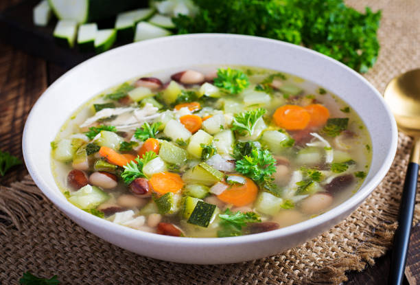 istock Chicken fillet vegetable soup in  bowl on wooden rustic table. 1327421912