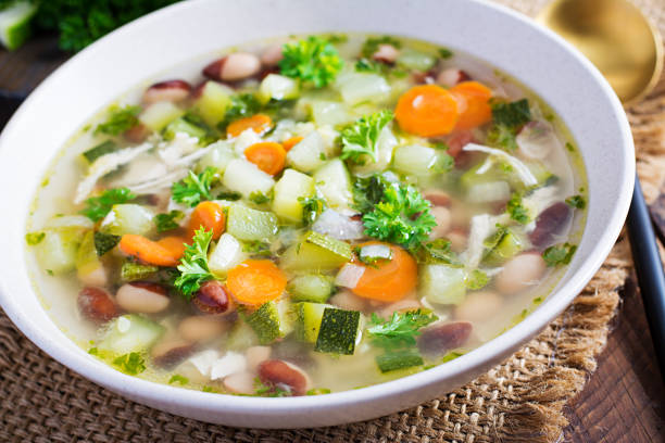 istock Chicken fillet vegetable soup in  bowl on wooden rustic table. 1327421916