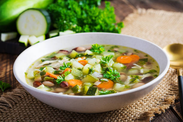 istock Chicken fillet vegetable soup in  bowl on wooden rustic table. 1327421917
