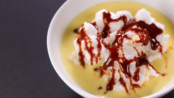 istock bowl of floating island with caramel 1327422737