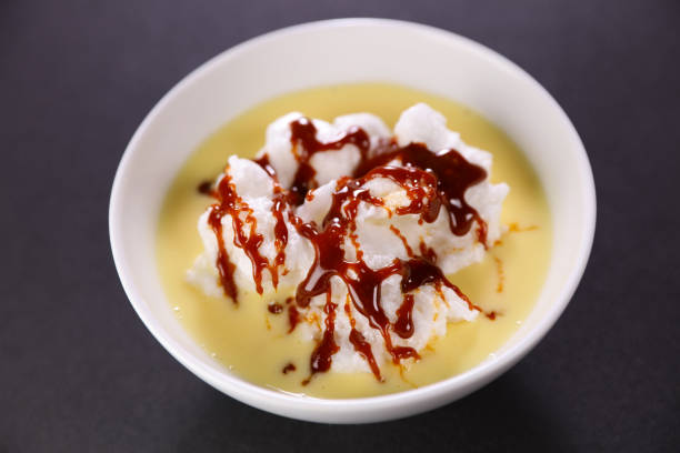 istock bowl of floating island with caramel 1327422796
