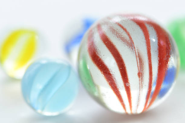 istock Colorful glass marbles on white background. 1327425707
