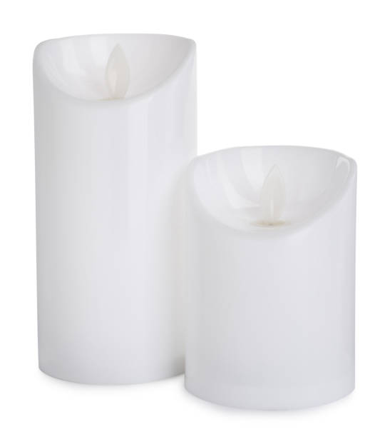 istock Decorative flameless LED candles on white background 1327425894