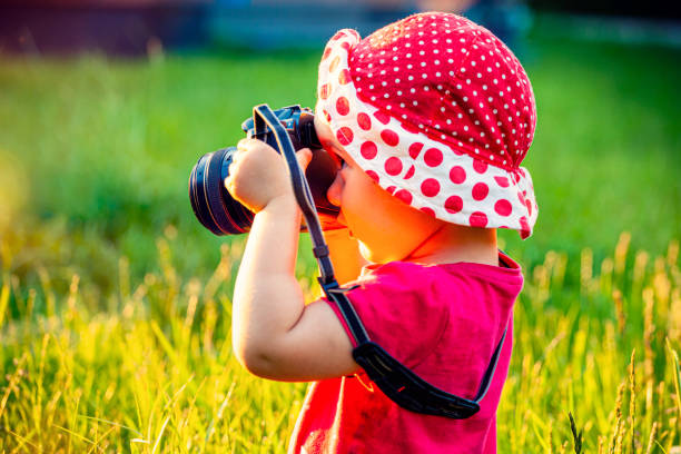istock Little girl with the camera 1327425921