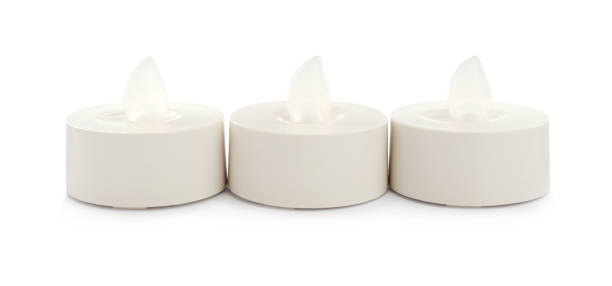 istock Decorative flameless LED candles on white background 1327426520