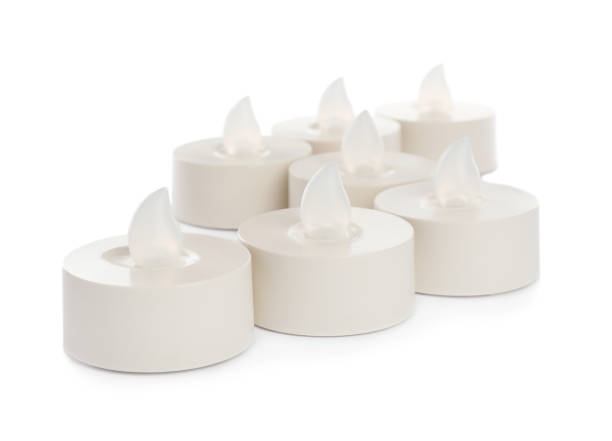 istock Decorative flameless LED candles on white background 1327426665