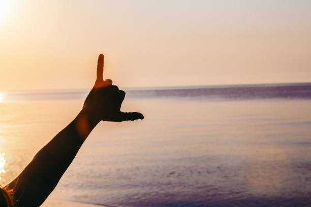 istock man hand showing different symbol. carefree 1327427081