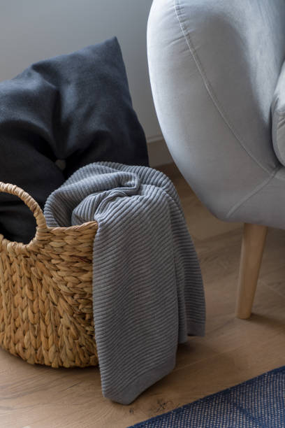 istock Decorative wicker basket with pillow and blanket 1327428212