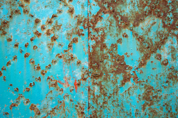istock Old rusty metal sheet with turquoise paint. 1327428315