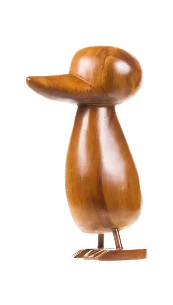 Photo of Carved wooden bird on the white background