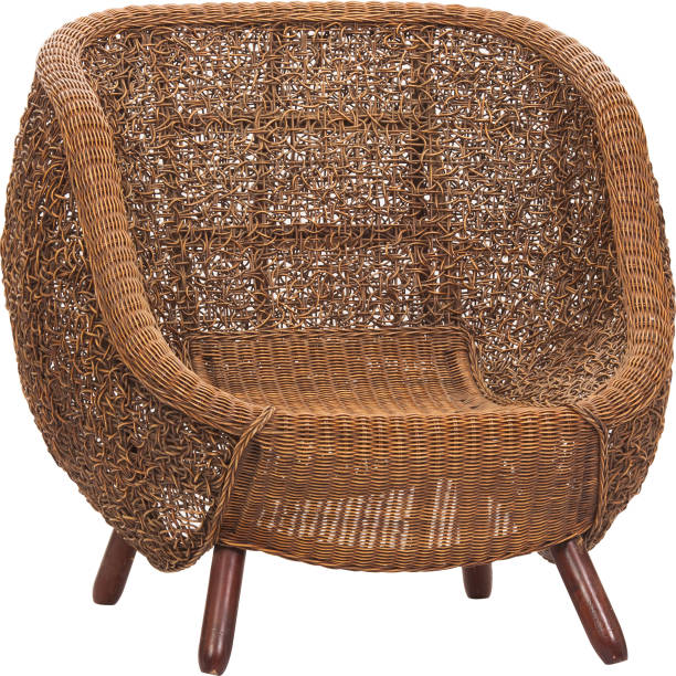 istock Wicker chair with white pillow isolated 1327430896