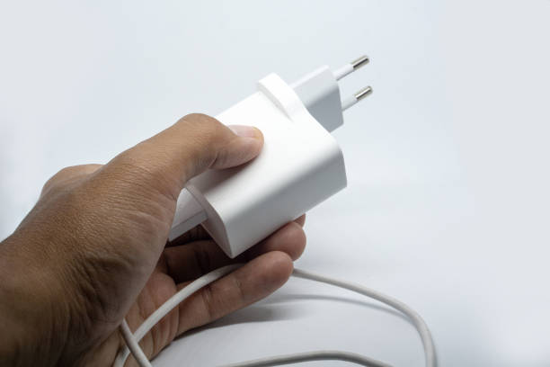istock left hand man holding usb smartphone charger 1327433477