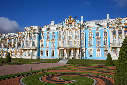 View of the beautiful exterior of Catherine Palace and the gardens. Catherines Palace is a Rococo palace in Tsarskoye Selo (Pushkin), 30 km south of St. Petersburg, Russia. It was the summer residence of the Russian tsars.