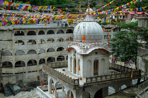 Manikaran, India - June 2021: Gurudwara Sahib Manikaran with thermal springs is a pilgrimage centre for Sikhs in the Parvati Valley on June 17, 2021 in Manikaran, Himachal Pradesh, India.