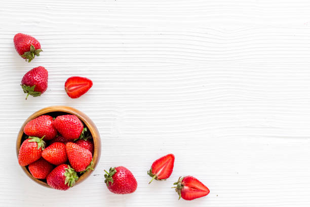istock Fresh strawberry with leaf in bowl. Berry background. Top view 1327435776