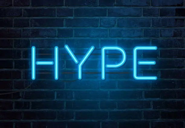 Hype neon sign on brick wall
