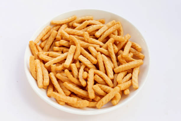 istock Prawn cracker sticks on white background. Shrimp crisp rice snack 1327438043