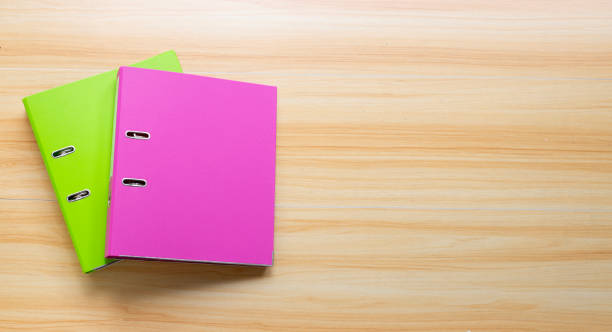 istock Office folders on wooden table texture background. Top view 1327439762
