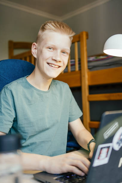 istock Young man smiling and looking at camera. 1327439837