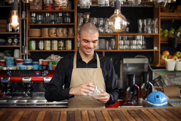 Bartender cleaning a glass