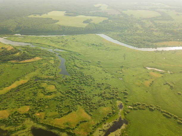 istock Beautiful summer landscape with a drone on the river, flood meadows, fields, forests 1327442057