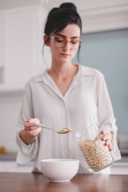 istock Beautiful woman in her apartment 1327442082