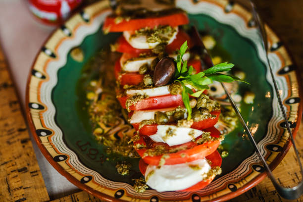 istock Tasty caprese salad with tomatoes and mozzarella 1327447333