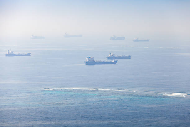 Industrial cargo ships are waiting for entrance to Jeddah port Industrial cargo ships are waiting for entrance to Jeddah port on a sunny day. Red Sea, Saudi Arabia saudi arabia jeddah landscape stock pictures, royalty-free photos & images