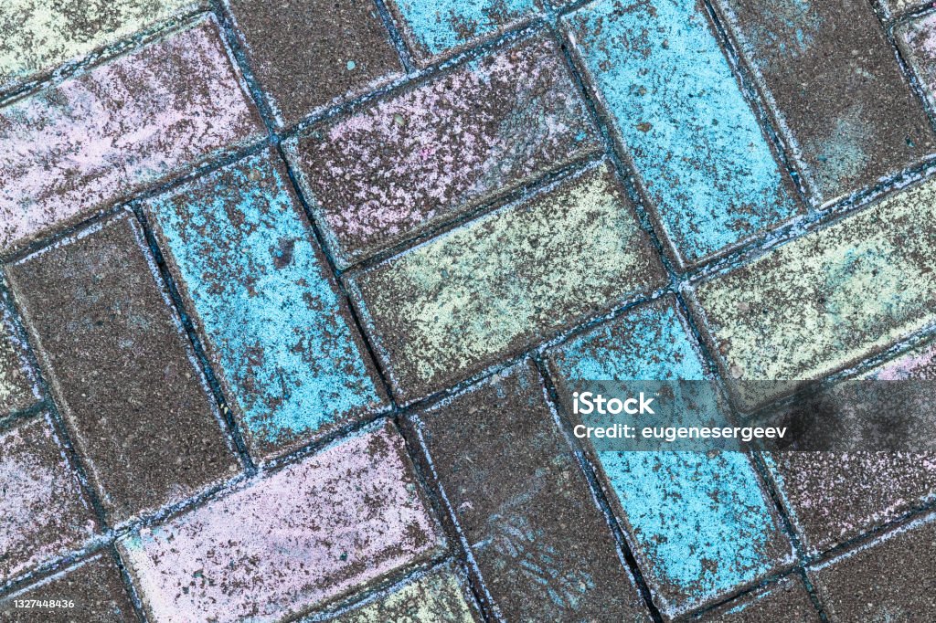 Colorful cobble stones painted with chalk Colorful cobble stones painted with chalk, road pavement, photo texture Chalk Drawing Stock Photo