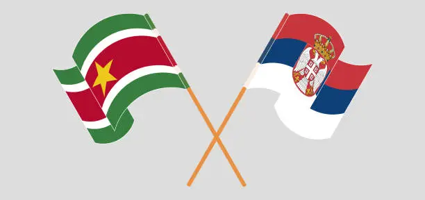 Vector illustration of Crossed and waving flags of Suriname and Serbia