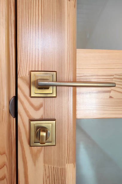 istock Wooden door with glass, handle and lock. 1327449370
