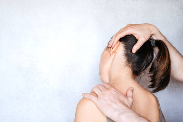 istock A chiropractor performing a manipulation on woman's neck and administering of spinal adjustments to relive neck pain 1327451146
