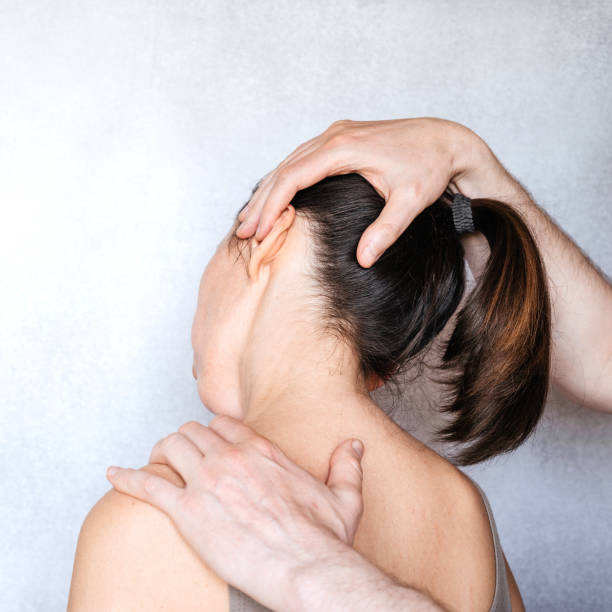 istock A chiropractor performing a manipulation on woman's neck and administering of spinal adjustments to relive neck pain 1327451170