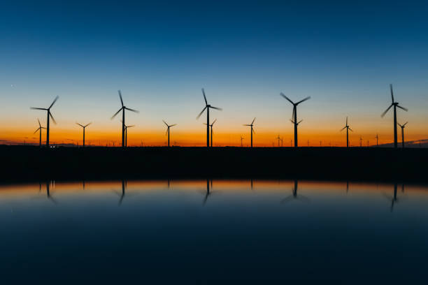 istock Sunset Landscape by the sea with Wind turbines 1327451327